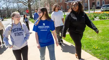 Fredonia students walking on campus. prospective students asking themselves how do i choose a college? can learn from the tips below how to make the best decision for their future. 