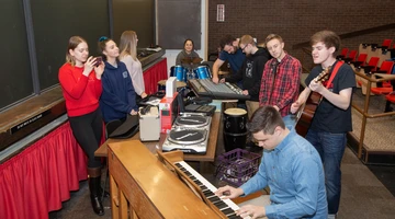 Students engaged with an activity in a music industry project