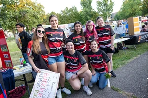 photo of women's rugby team in uniform at Activities Night