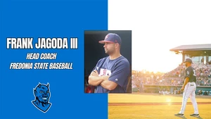 Jagoda standing on baseball field