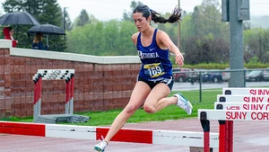 female athlete running the steeplechase