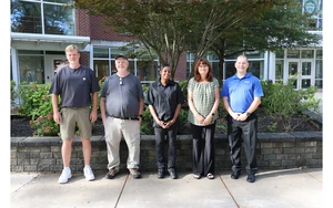 Administrative service award recipients standing in a row