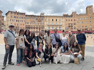 Gathering in front of Piazza del Campo in Siena, Italy, are (front row, from left): Nia Anand, Caitlyn Sterner, Eli Conrad, Paige Smith, Jean Castro and Vanessa Lotito; (back row): Associate Professor Peter Tucker, Maya Kulick, Andrea Conner, Brittany Howe, Kady Osborne, Jaivon Eggleston, Noah Freeland, Sarah Crouse, Olivia Schindler and Professor David Kinkela.