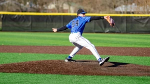 baseball pitcher in action on the pitching mound
