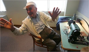 Bernard Adler at a sewing machine