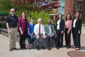 President Stephen H. Kolison Jr. (center), flanked by SUNY Chancellor’s Award for Excellence recipients (from left): Anthony Pagano Jr., Dr. Angela McGowan-Kirsch, Rebecca Cuthbert, John C. Stone, Andrea Wasiura, Dr. Natalie Gerber and Dr. Anne Kissel.