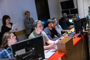 communication students working in the TV studio