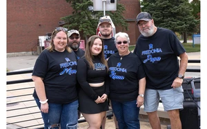 group of family members in matching t-shirts