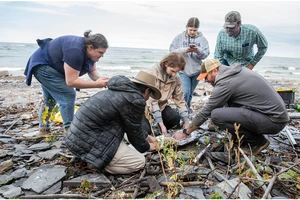 Randy Blood (far right) shows students how to properly wrap a core after it has been extracted.
