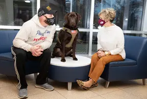 Matt Wronski, service dog, and Associate Provost Judith Horowitz