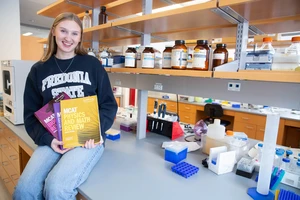 Julia Skiba, with three Kaplan Test Prep texts she is using to prepare for the MCAT exam. She plans to attend medical school and become a dermatologist.