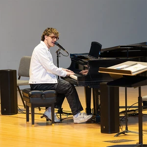 Lucas West performs on the piano in King Concert Hall