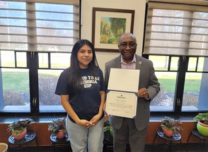 McConney Award recipient Moraya Sorimar Bautista with President Stephen H. Kolison Jr.