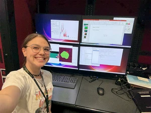 Isabelle “Belle” Price, in front of computers used to analyze x-ray absorption near edge structure (XANES) data.