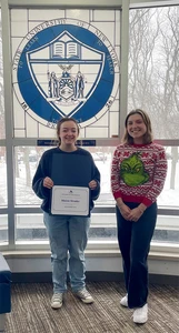Maisie Strader, with her Student of the Month certificate, and Donna Good West, residence director of Chautauqua Hall. 