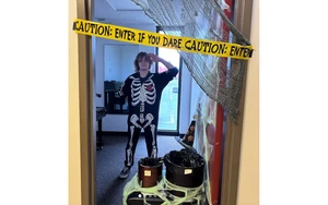 practice room decorated for Halloween with student in costume