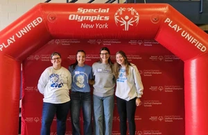 Graduate students in the College of Education, Health Sciences, and Human Services (from left): Charlie Shields, majoring in Literacy Education (Birth-12), of Canandaigua, NY; and Holly Rohrbach, Avon, NY; Macy Short, Dryden, NY; and Alissa Dixon, East Aurora, NY, all majoring in Curriculum and Instruction Inclusive Education, helped to conduct the Special Olympics Unified Champion Schools summit.