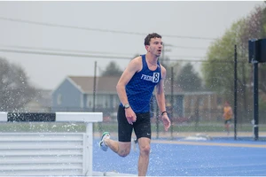 SUNY Fredonia athlete running the steeplechase