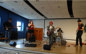 band playing on stage in the Williams Center