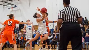 Rae White (22) goes for two points