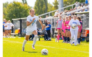 soccer player in action by Travis Bernhard