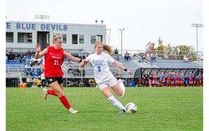 soccer players in action on the field