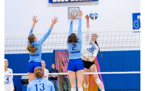 women playing volleyball by Travis Bernhard