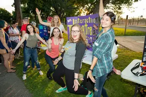 happy students celebrating Activities Night at Fredonia