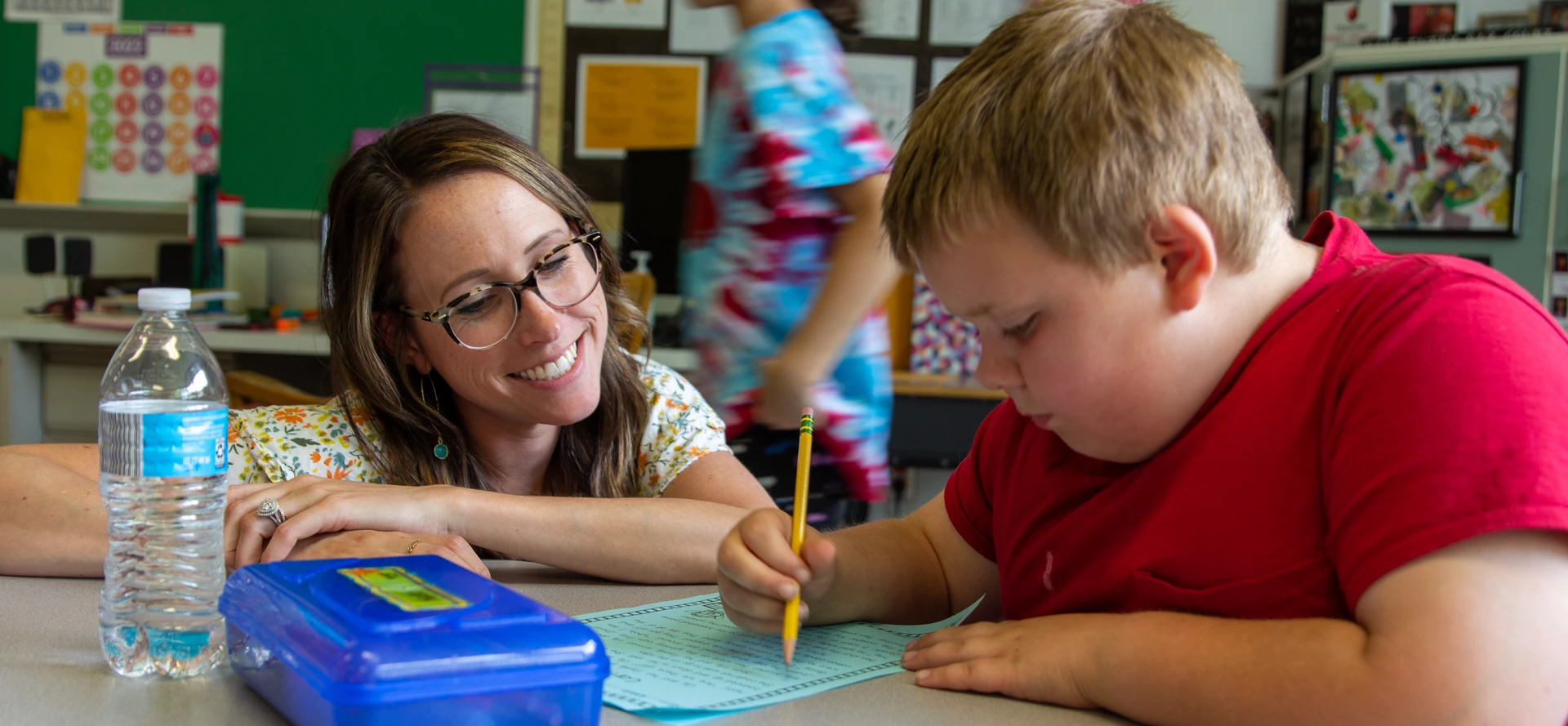 teacher and student working together