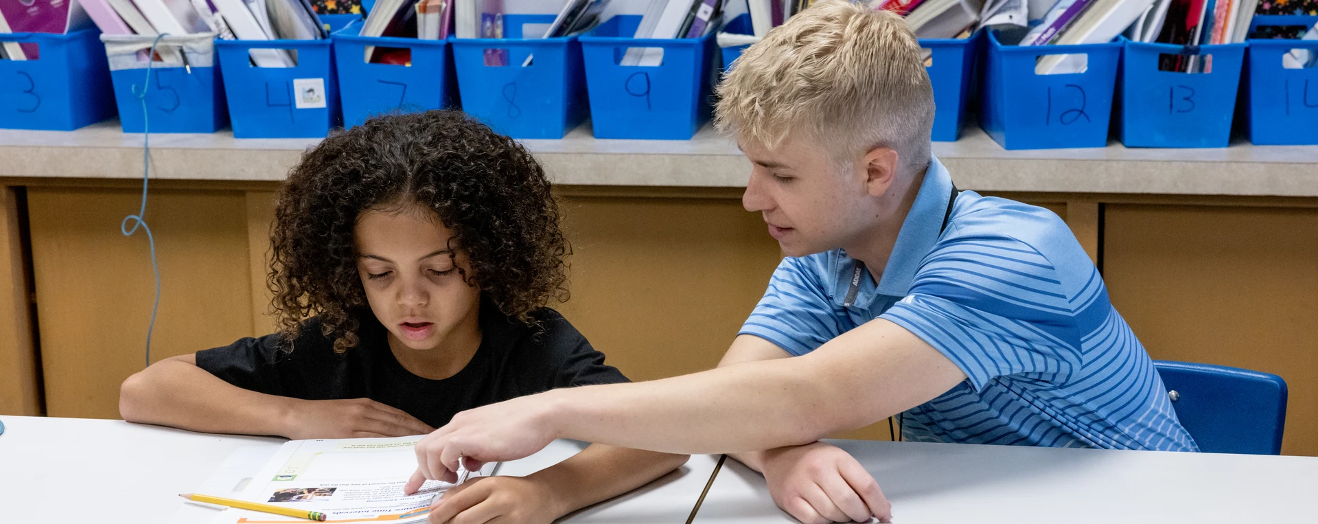 Fredonia student working with elementary kids during their field experience
