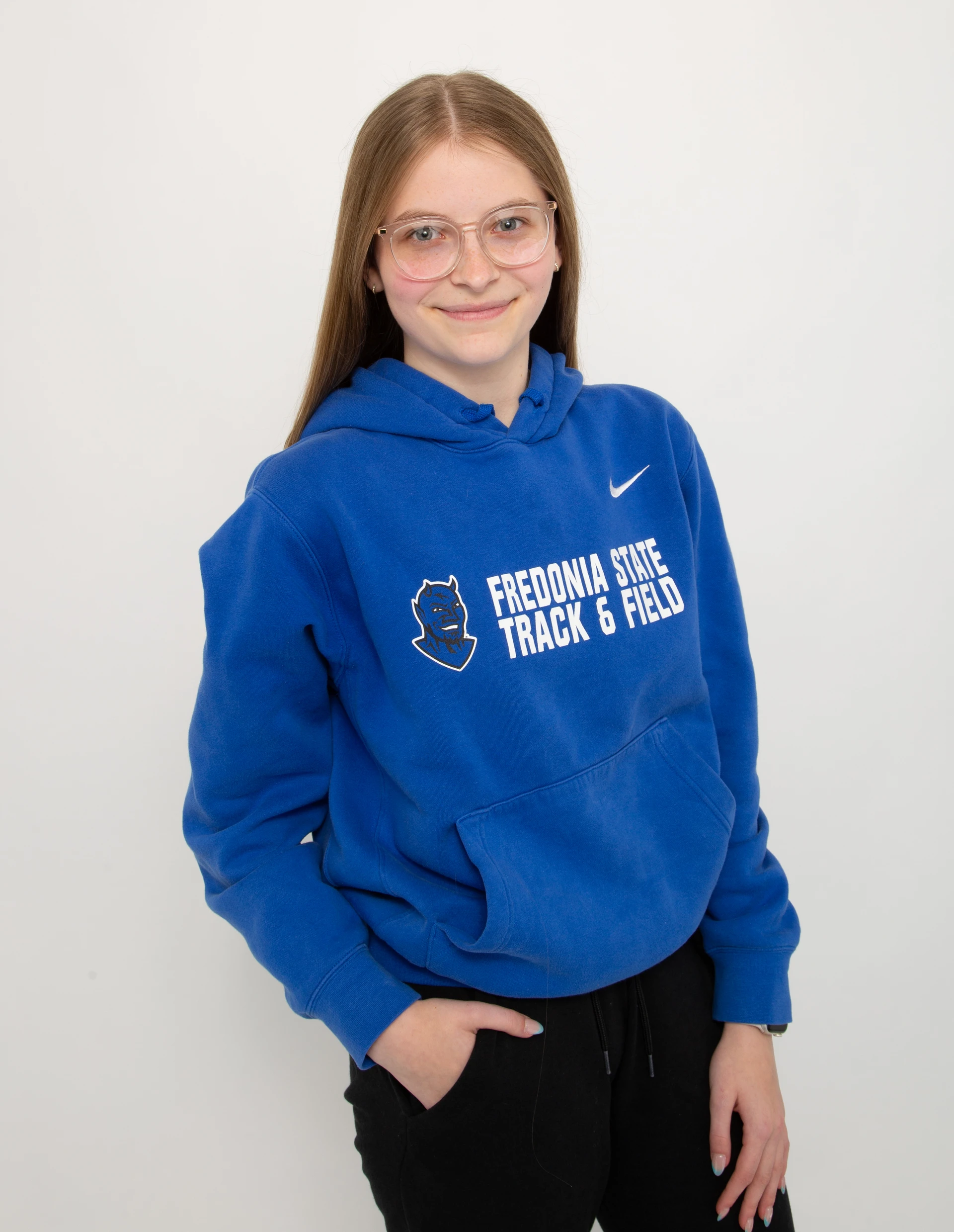 Student in the College of Liberal Arts and Sciences Hayley Mercer in their Fredonia hoodie