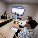 Fredonia students having a meeting in a business classroom