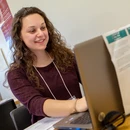 Fredonia student working on a computer 