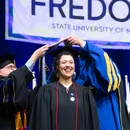 student being hooded at graduation