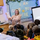Fredonia student teacher in a classroom presenting to children