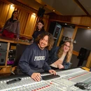 Students making music in the studio