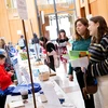 students at tables of potential employers in the Williams Center