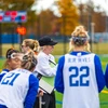 Coach Poffenberger coaching on the sidelines with athletes