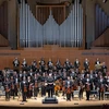members of the College Symphony standing on the King Concert Hall stage
