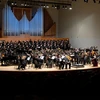 orchestra playing in King Concert Hall with chorus