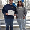 Ryan Packard holding certificate and Eisenhower Hall Residence Director Christian Taber.