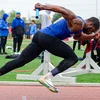 runner with baton in mid-stride