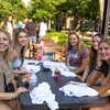 students sitting on the patio enjoying an event