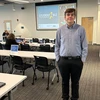 Zachary Dean standing in a classroom