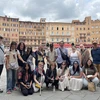 Gathering in front of Piazza del Campo in Siena, Italy, are (front row, from left): Nia Anand, Caitlyn Sterner, Eli Conrad, Paige Smith, Jean Castro and Vanessa Lotito; (back row): Associate Professor Peter Tucker, Maya Kulick, Andrea Conner, Brittany Howe, Kady Osborne, Jaivon Eggleston, Noah Freeland, Sarah Crouse, Olivia Schindler and Professor David Kinkela.