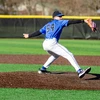 baseball pitcher in action on the pitching mound