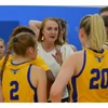 Coach Bullock with athletes on the court