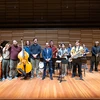 Dr. Nick Weiser (center) and 15 students who comprise the Fredonia Jazz Flextet, which won a top DownBeat Magazine’s Student Music Award gather for a group photo following the award announcement made in the Juliet J. Rosch Recital Hall.
