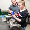 Mia Enders, a junior Geology major from Bath, NY, with Dr. Thomas Hegna, operates equipment that pulverizes and grinds rocks for analysis.