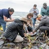 Randy Blood (far right) shows students how to properly wrap a core after it has been extracted.
